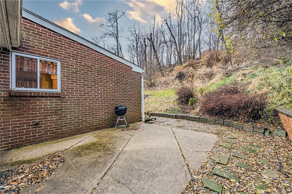 549 Filmore Road Pittsburgh, PA 15221 - Photo 21 of 25 a view of a backyard with a large tree