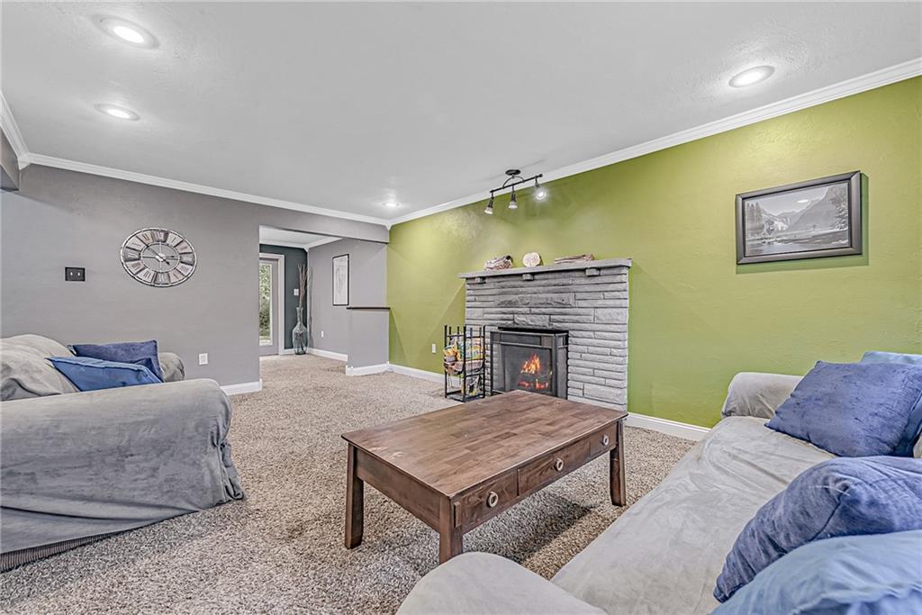 549 Filmore Road Pittsburgh, PA 15221 - Photo 3 of 25 a living room with furniture and a fireplace