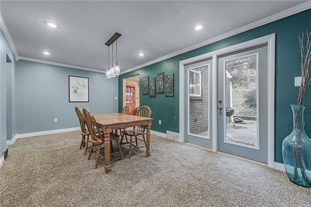549 Filmore Road Pittsburgh, PA 15221 - Photo 7 of 25 a view of a dining room with furniture window and outside view
