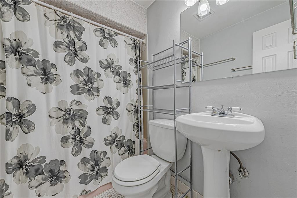 549 Filmore Road Pittsburgh, PA 15221 - Photo 10 of 25 a bathroom with a sink toilet and shower