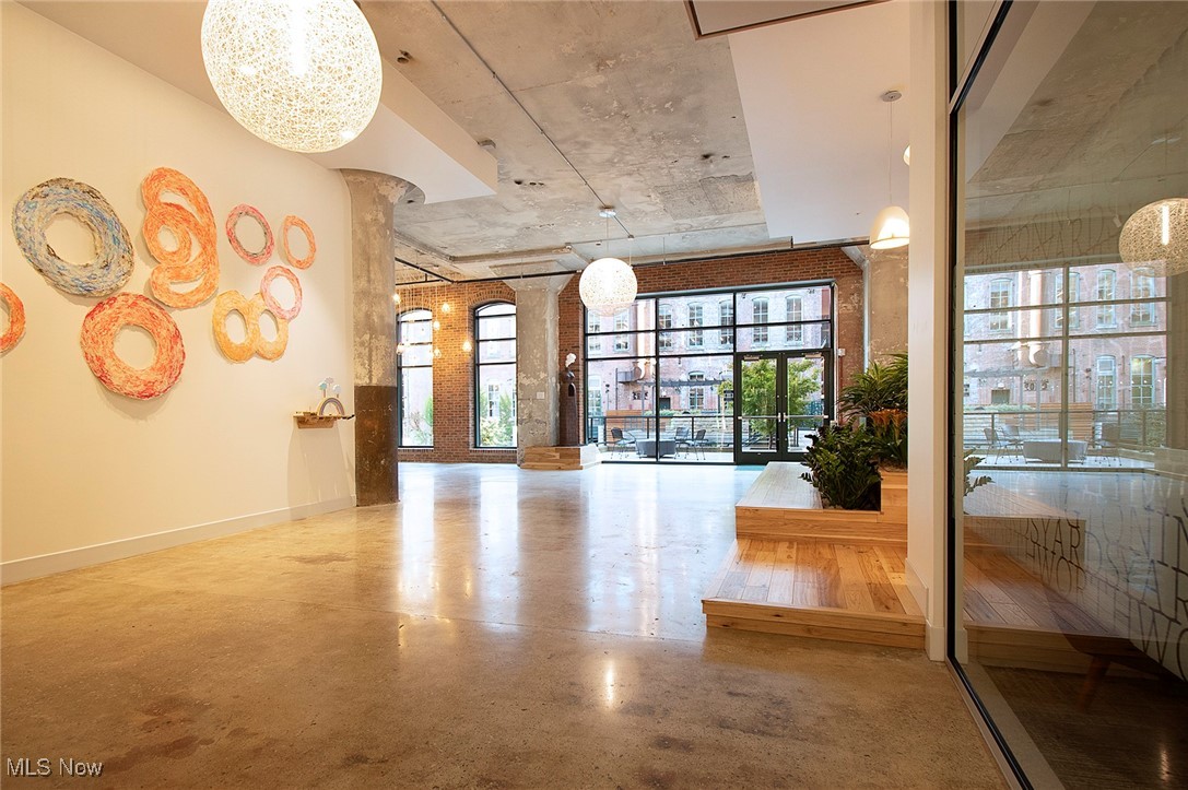 725 Johnson Court, Unit 220 Cleveland, OH 44113 - Photo 2 of 25 Main entrance featuring soaring ceilings, art gallery and view to internal courtyard.
