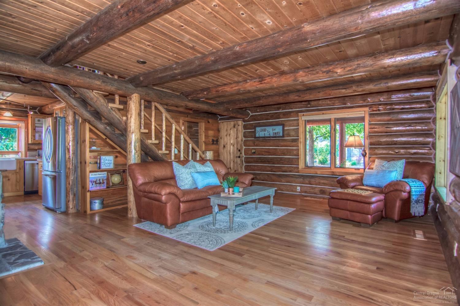 18762 Ridgecrest Road Bend, OR 97703 - Photo 8 of 25 a living room with furniture and a wooden floor