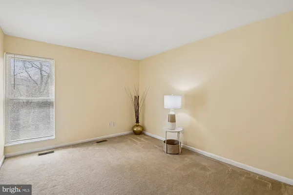 an empty room with a empty space and window