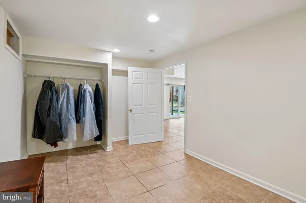 a bathroom with a sink a toilet a mirror and shower