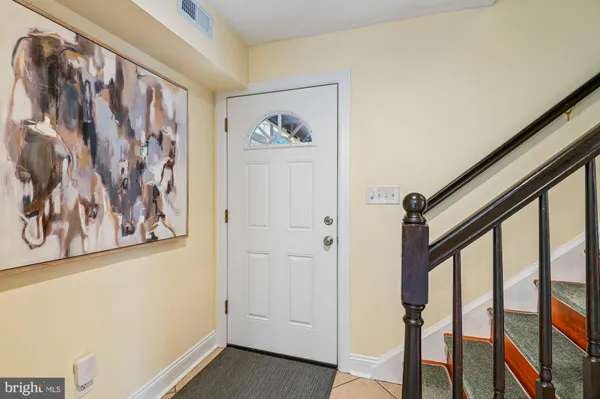 a view of a hallway with paintings on the wall