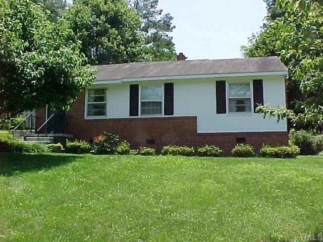 916 Mills Street Raleigh, NC 27608 - Photo 1 of 1 a front view of a house with a garden