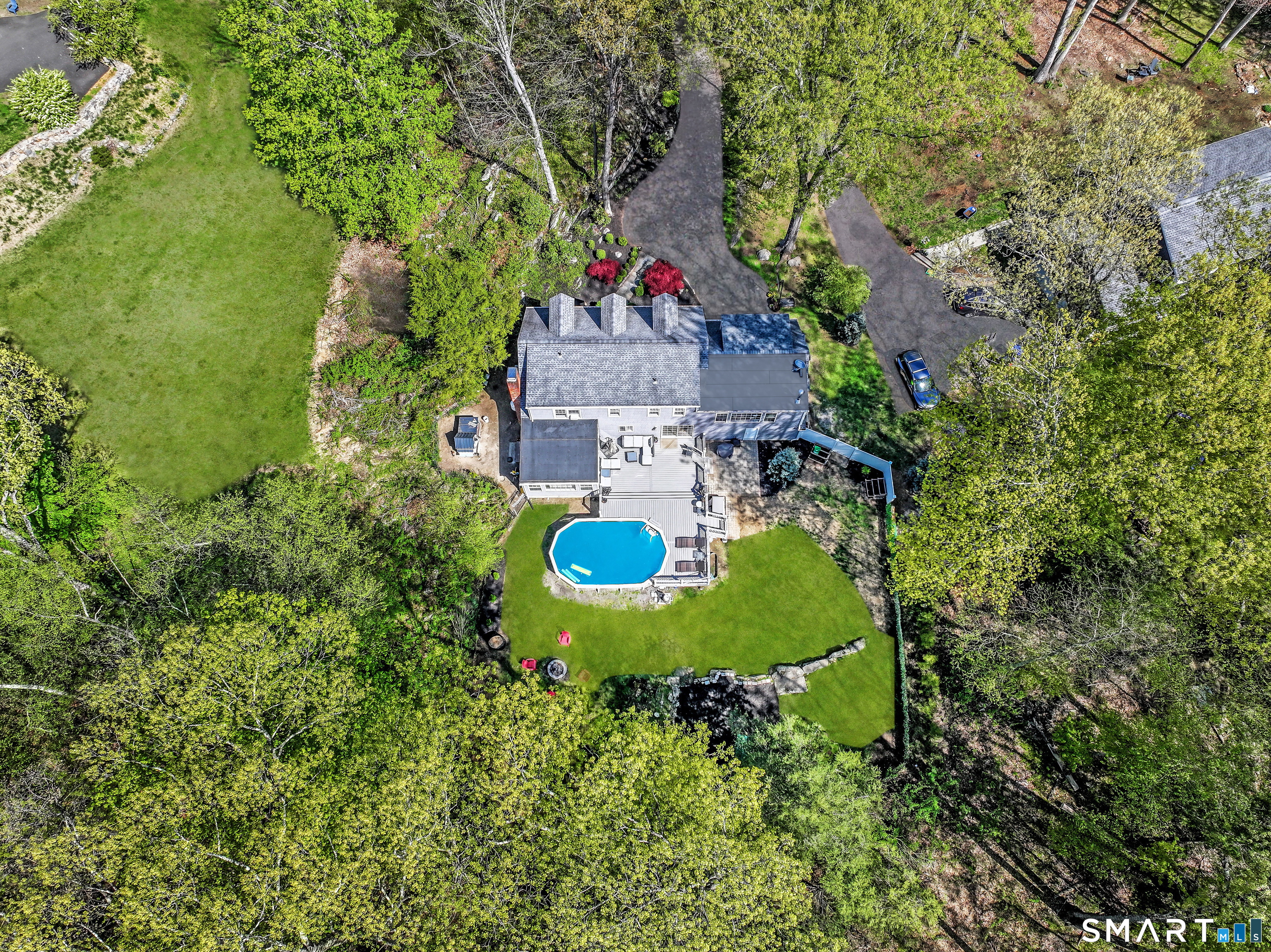 20 Puritan Valley Road Brookfield, CT 06804 - Photo 2 of 35 an aerial view of a house with a swimming pool yard and outdoor seating