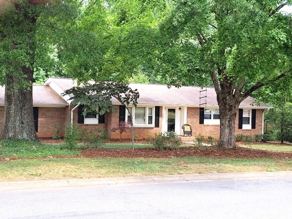 706 Fieldstone Road Mooresville, NC 28115 - Photo 1 of 11 a front view of a house with a yard garage and outdoor seating
