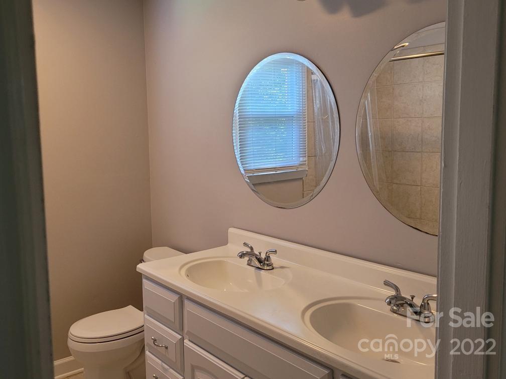 706 Fieldstone Road Mooresville, NC 28115 - Photo 10 of 11 a bathroom with a sink and a mirror