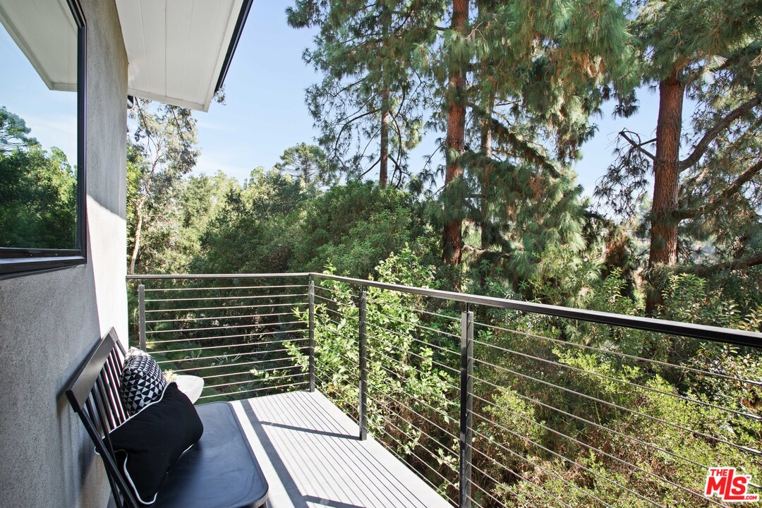 9015 Burroughs Road Los Angeles, CA 90046 - Photo 11 of 19 a view of balcony with wooden floor and fence