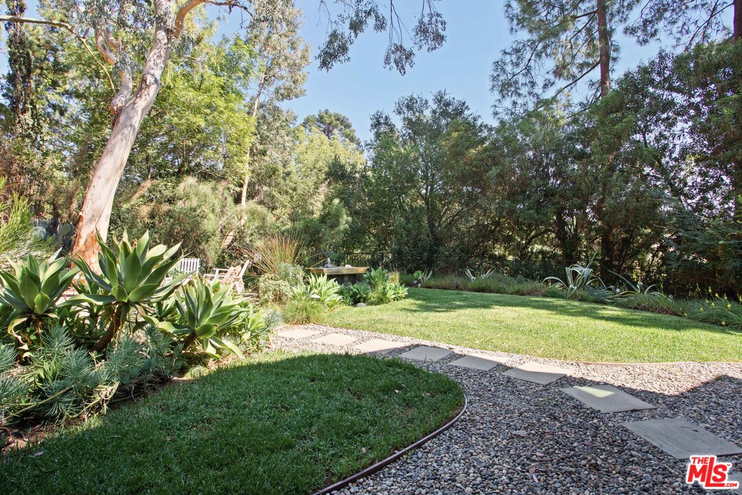 9015 Burroughs Road Los Angeles, CA 90046 - Photo 16 of 19 a view of a yard with a trees