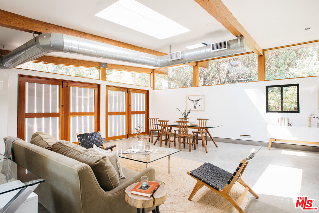 9015 Burroughs Road Los Angeles, CA 90046 - Photo 19 of 19 a living room with furniture and a large window