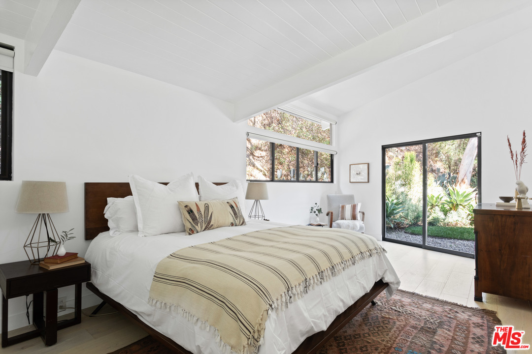 9015 Burroughs Road Los Angeles, CA 90046 - Photo 7 of 19 a bedroom with bed and a large window