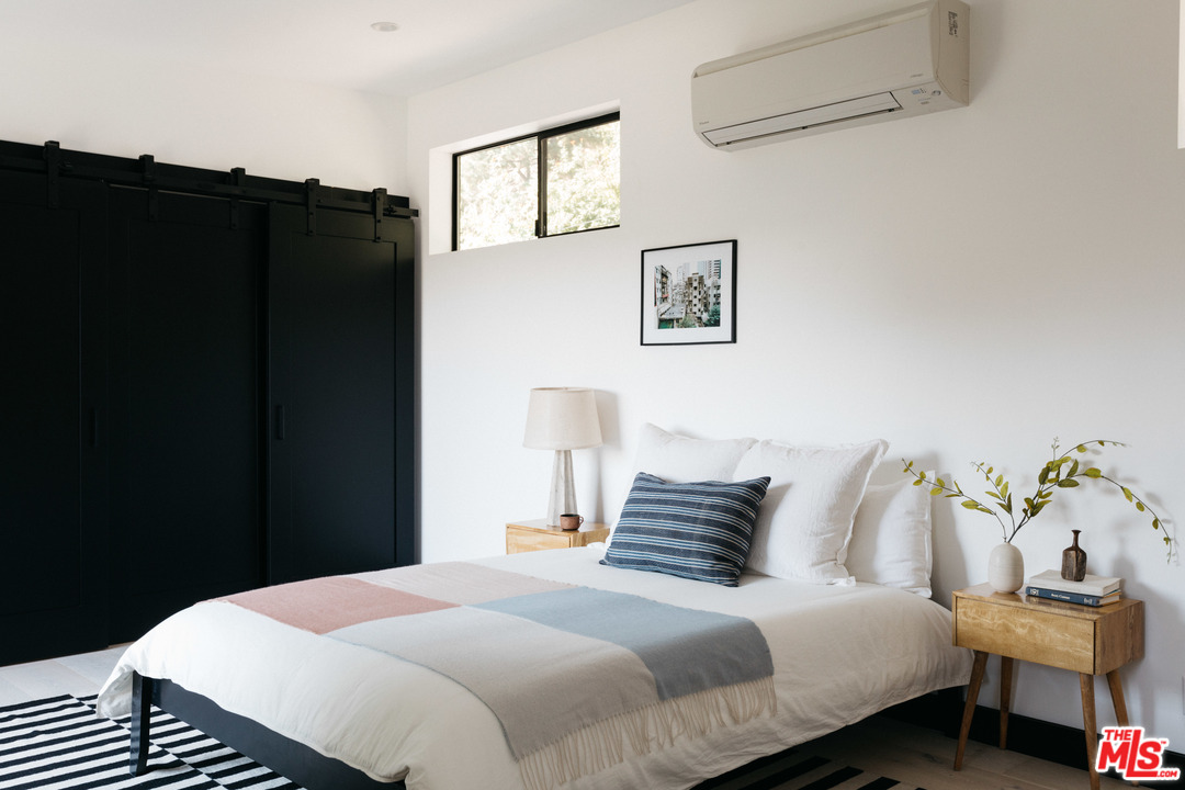 9015 Burroughs Road Los Angeles, CA 90046 - Photo 8 of 19 a bedroom with bed and window