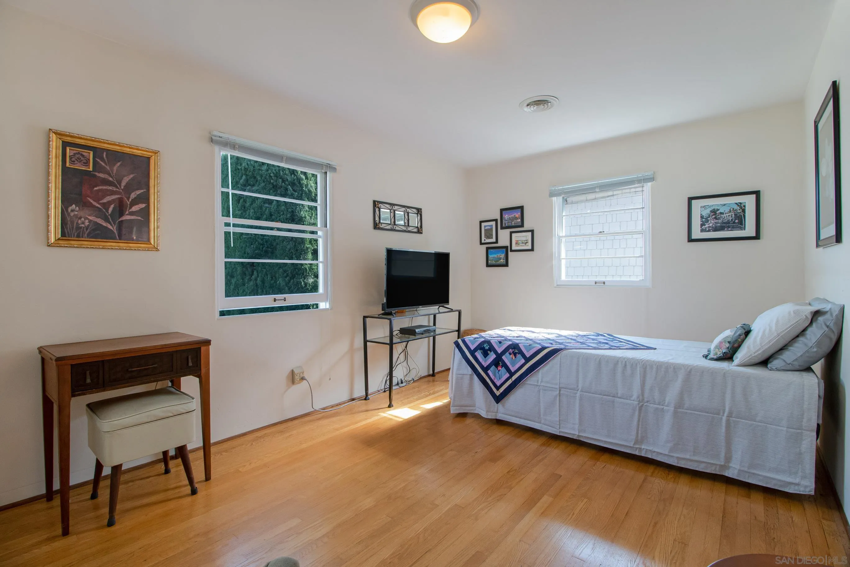 545 J Avenue Coronado, CA 92118 - Photo 12 of 26 a living room with furniture and a flat screen tv