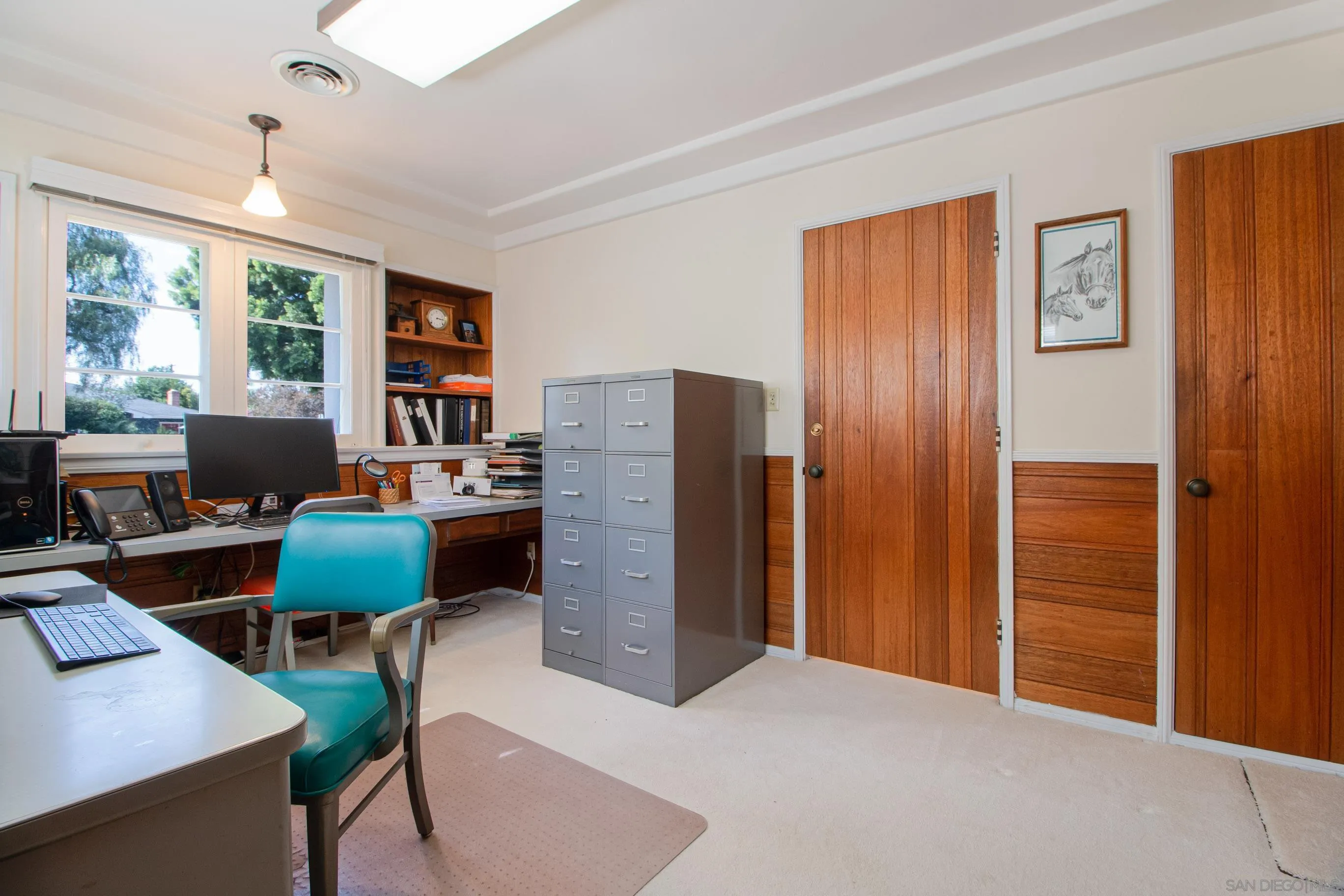 545 J Avenue Coronado, CA 92118 - Photo 14 of 26 a workspace with furniture and a window