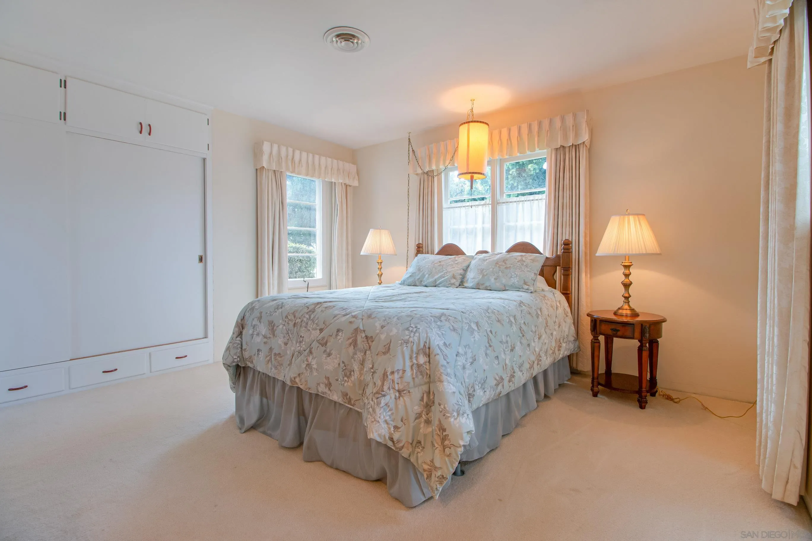 545 J Avenue Coronado, CA 92118 - Photo 15 of 26 a spacious bedroom with a bed and a window