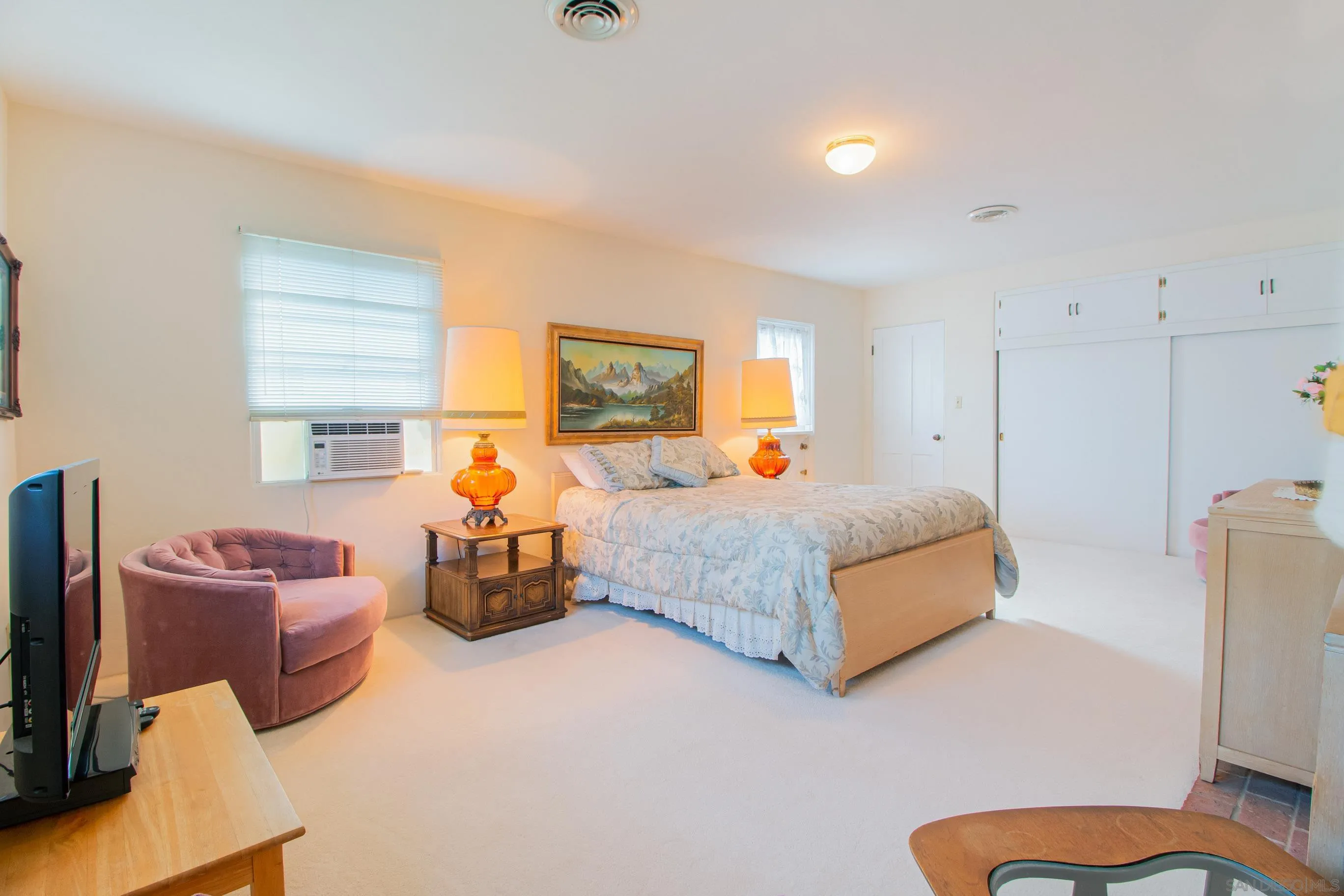 545 J Avenue Coronado, CA 92118 - Photo 17 of 26 a bedroom with bed and a couch