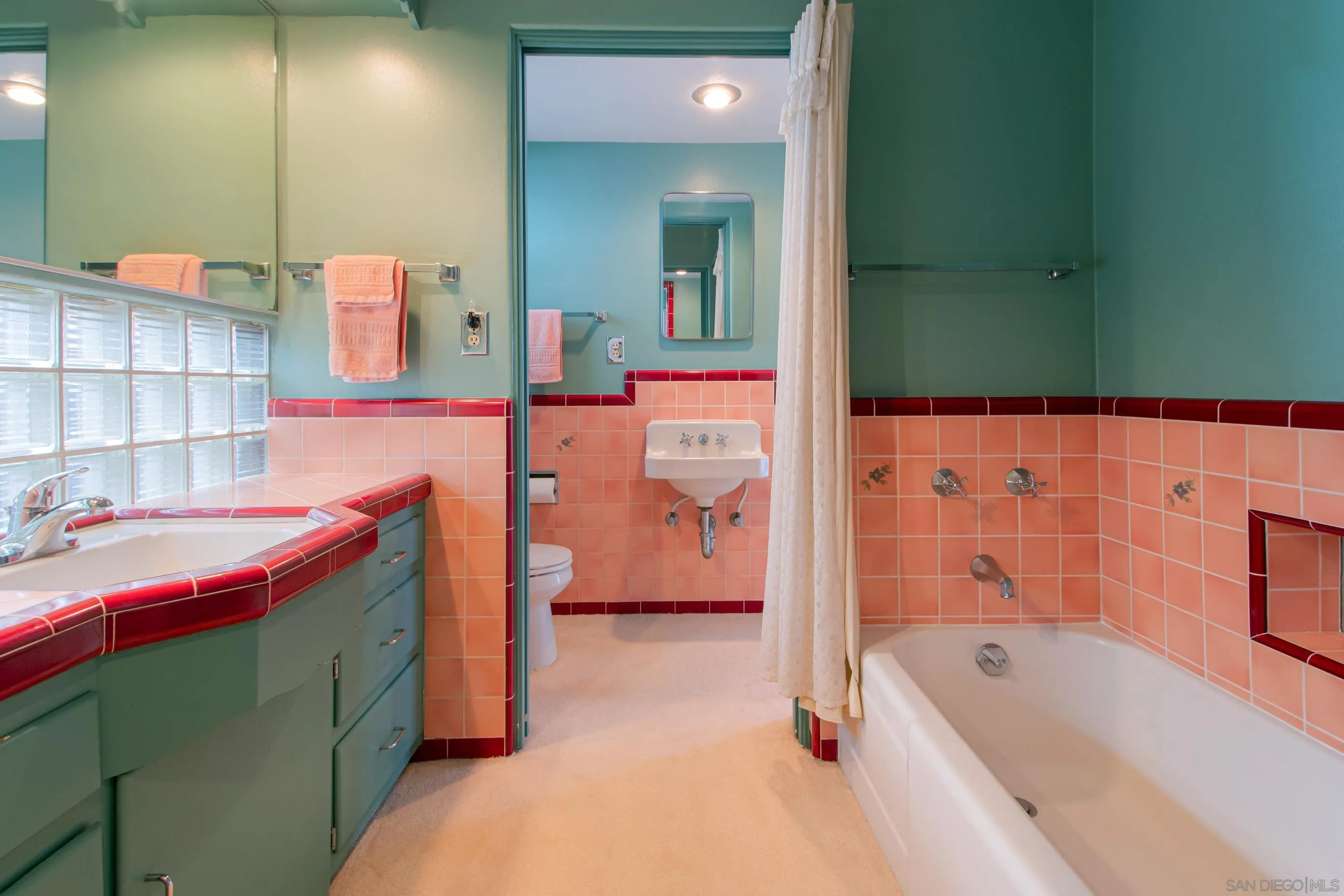 545 J Avenue Coronado, CA 92118 - Photo 19 of 26 a bathroom with a tub sink and mirror