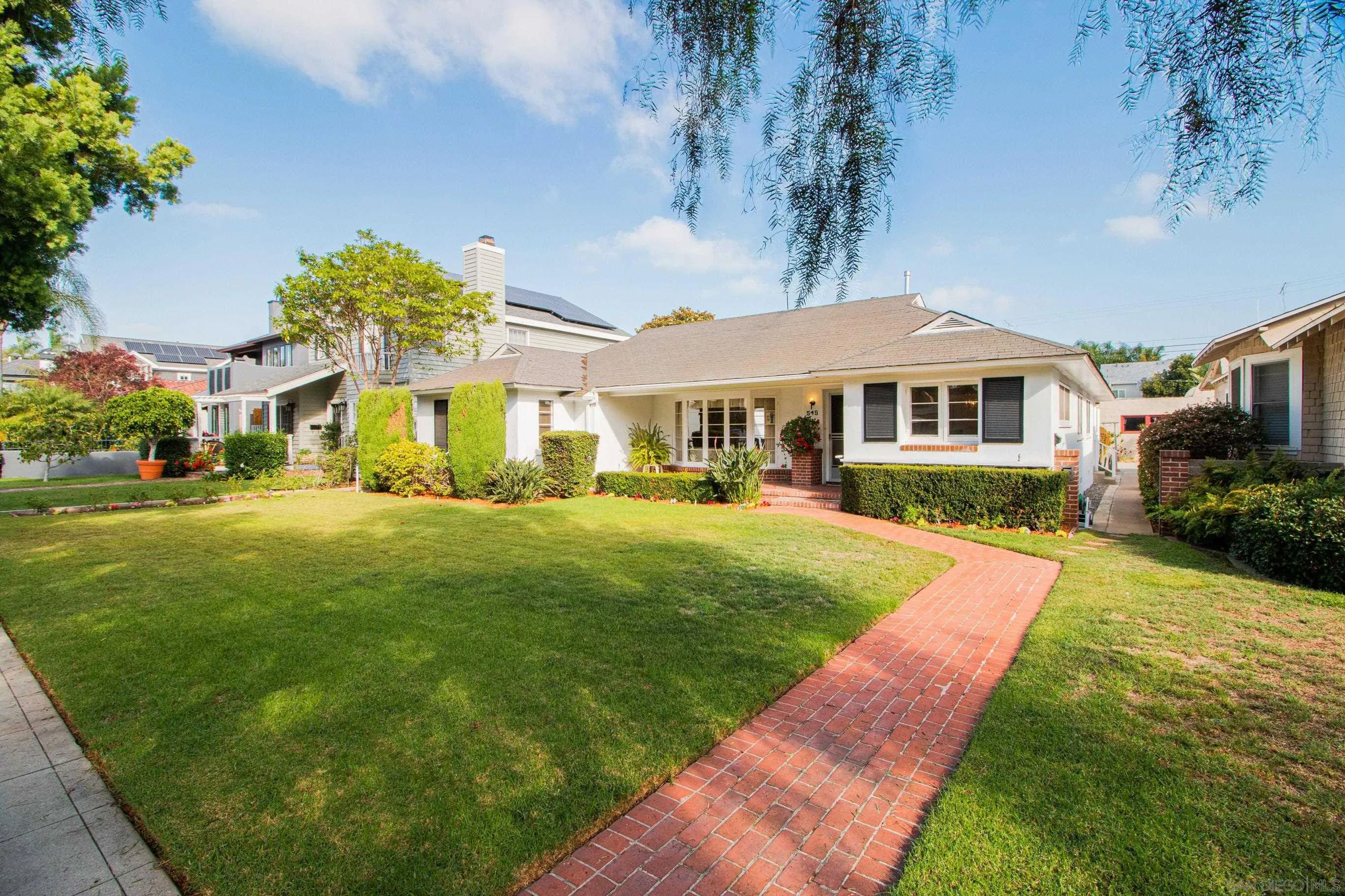 545 J Avenue Coronado, CA 92118 - Photo 2 of 26 a front view of a house with a yard