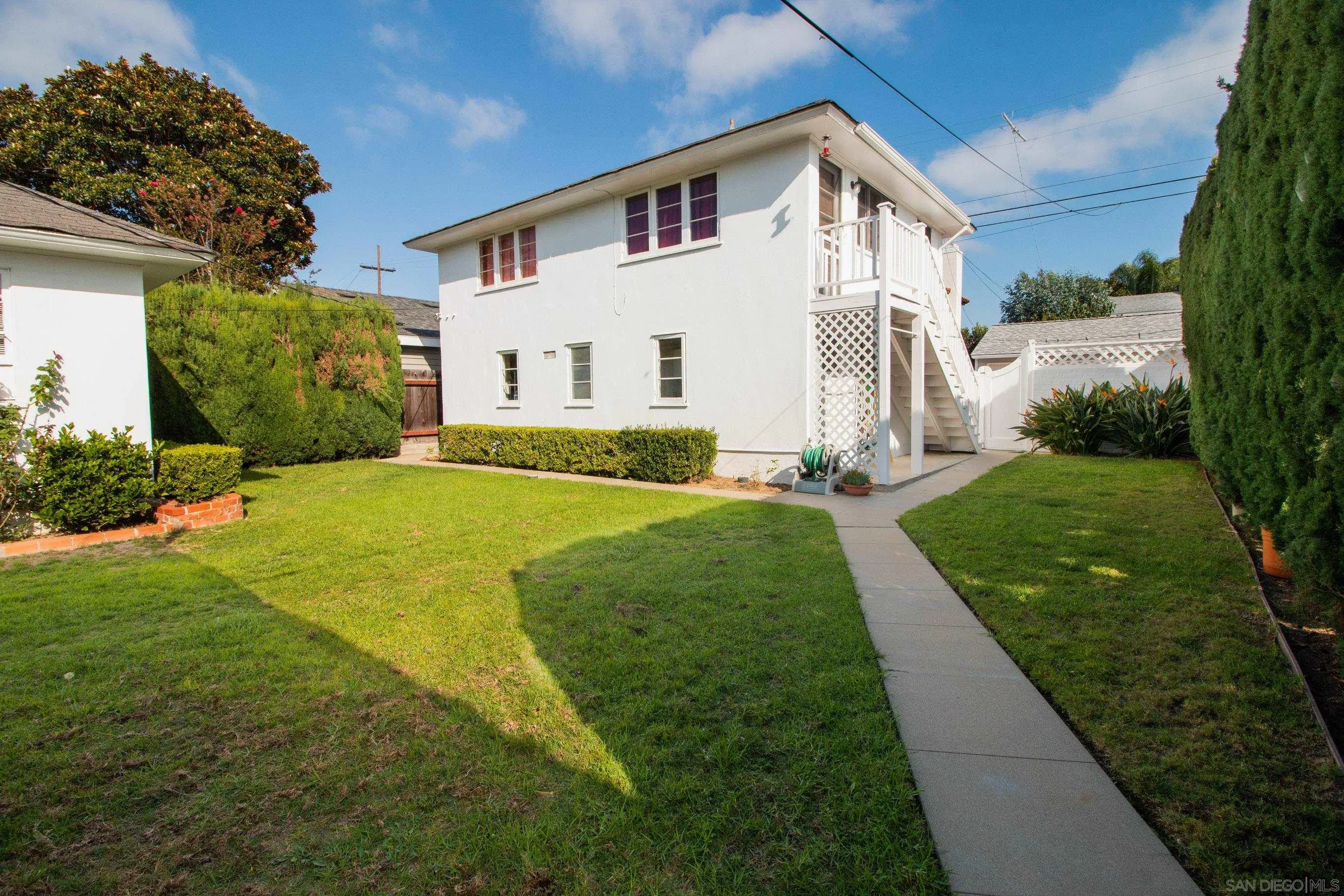 545 J Avenue Coronado, CA 92118 - Photo 22 of 26 a front view of a house with garden