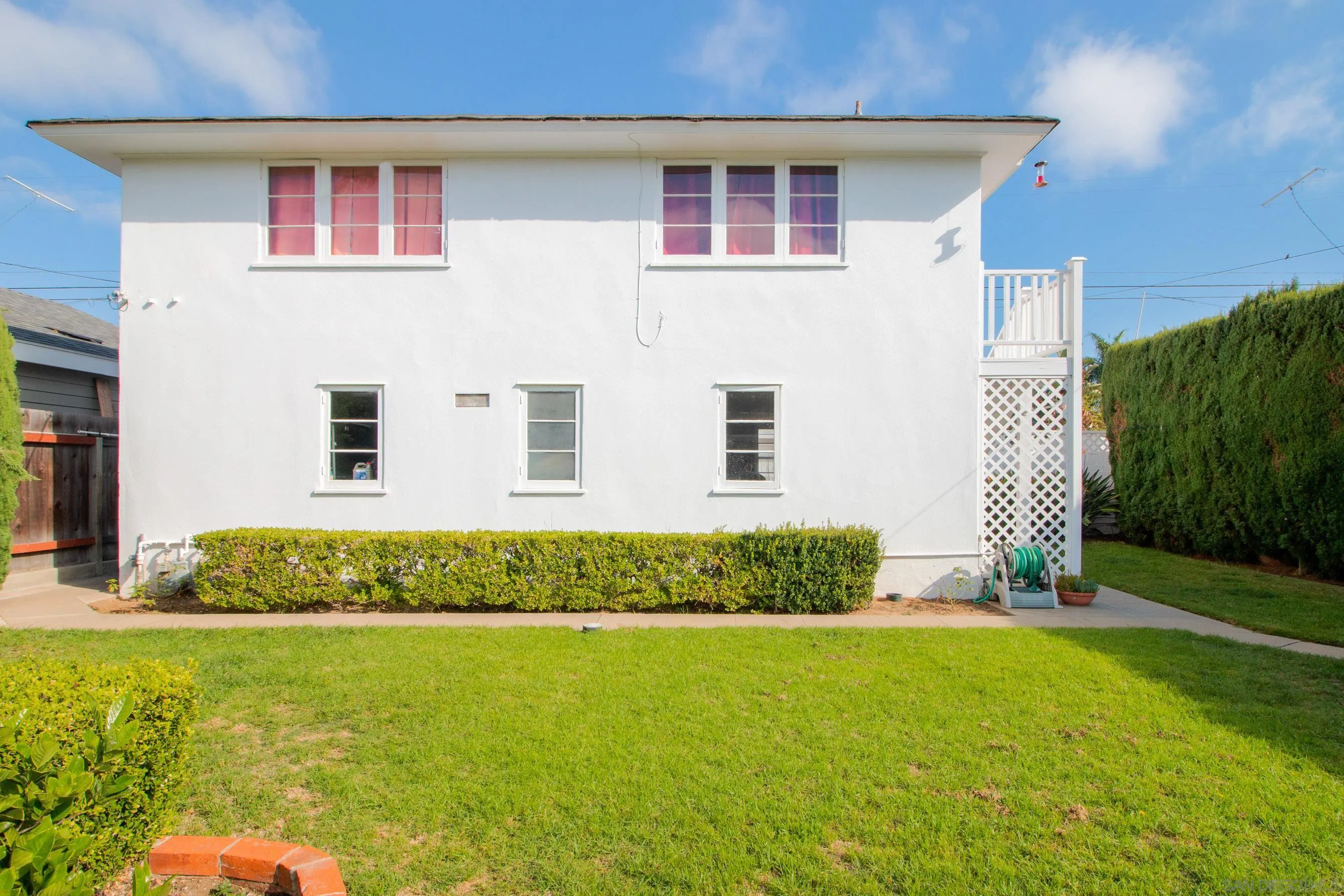 545 J Avenue Coronado, CA 92118 - Photo 23 of 26 a front view of a house with garden