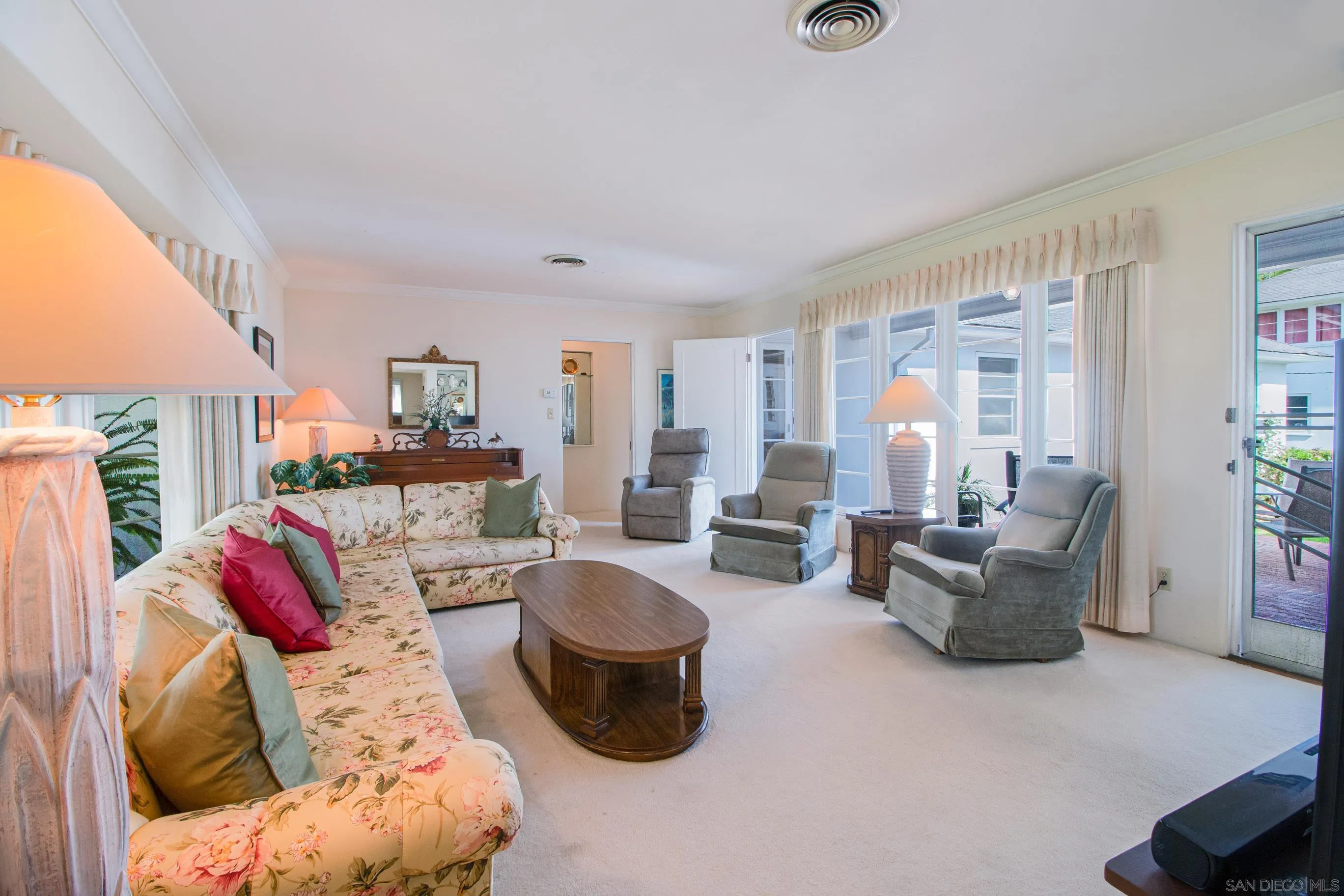 545 J Avenue Coronado, CA 92118 - Photo 4 of 26 a living room with furniture and a large window