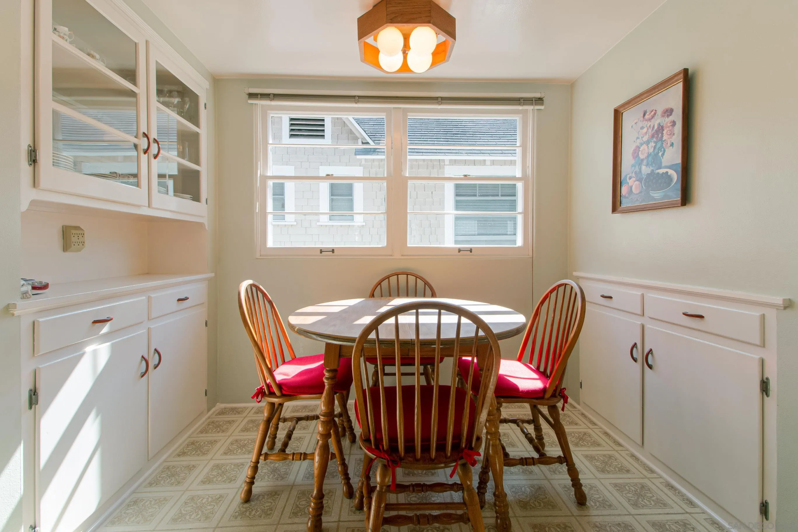 545 J Avenue Coronado, CA 92118 - Photo 8 of 26 a view of a dining room with furniture and a chandelier
