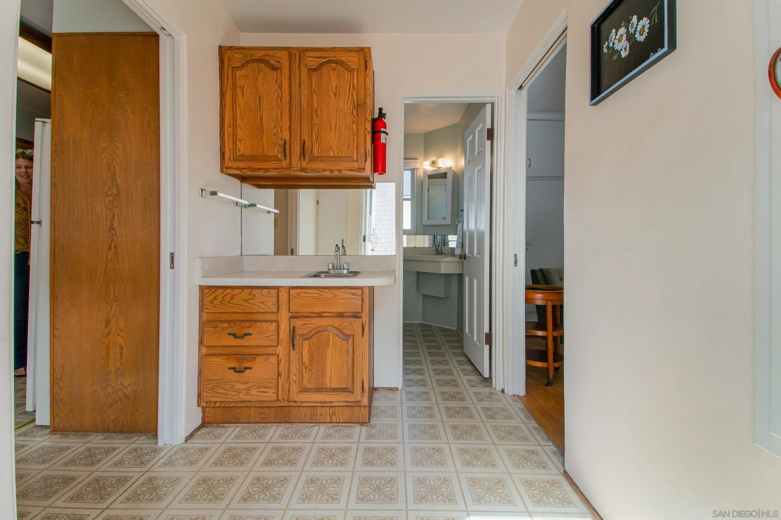 545 J Avenue Coronado, CA 92118 - Photo 10 of 26 a bathroom with a granite countertop sink a mirror and a shower
