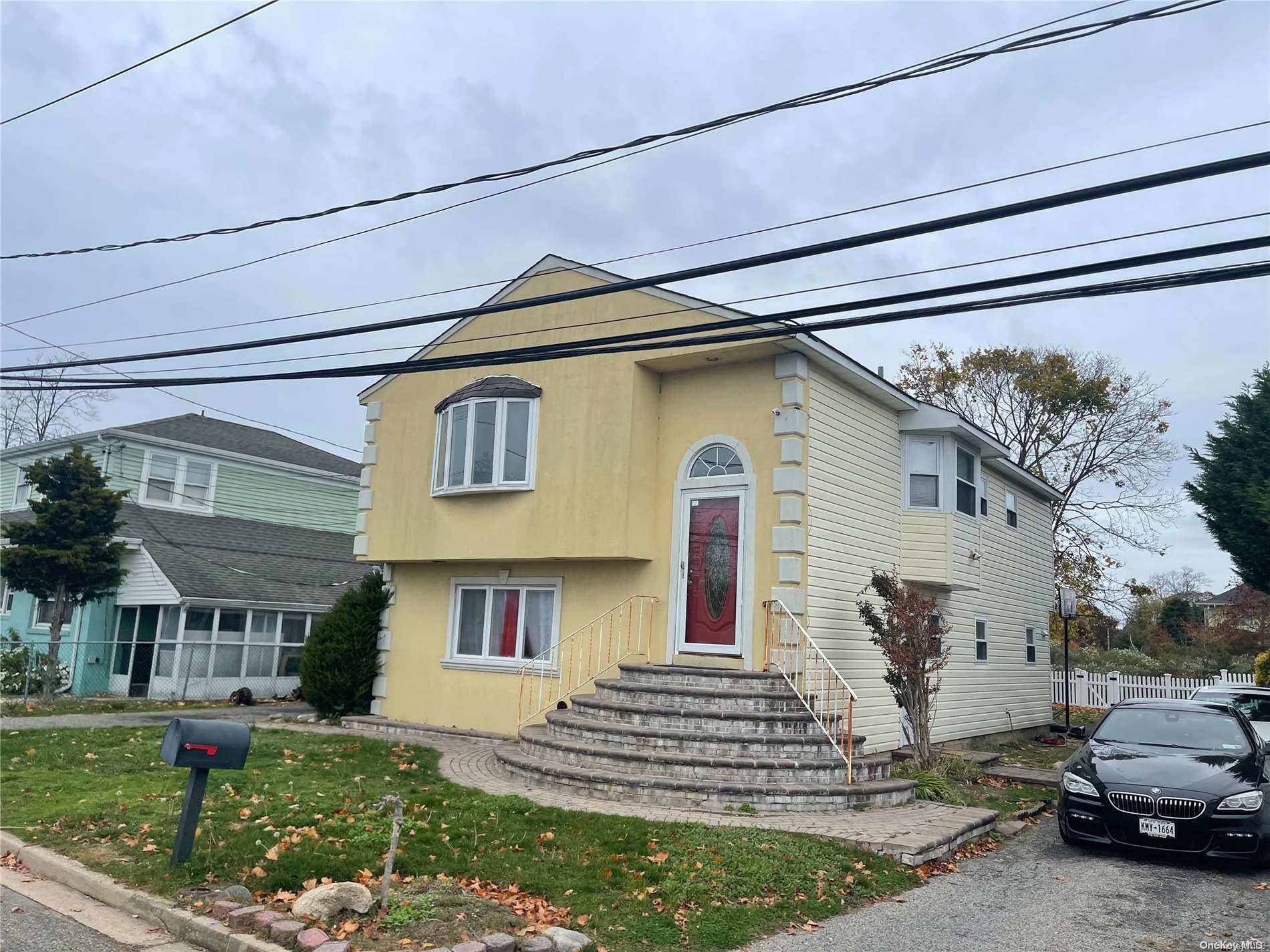 1 Delta Road Massapequa, NY 11758 - Photo 1 of 1 a front view of a house with a yard