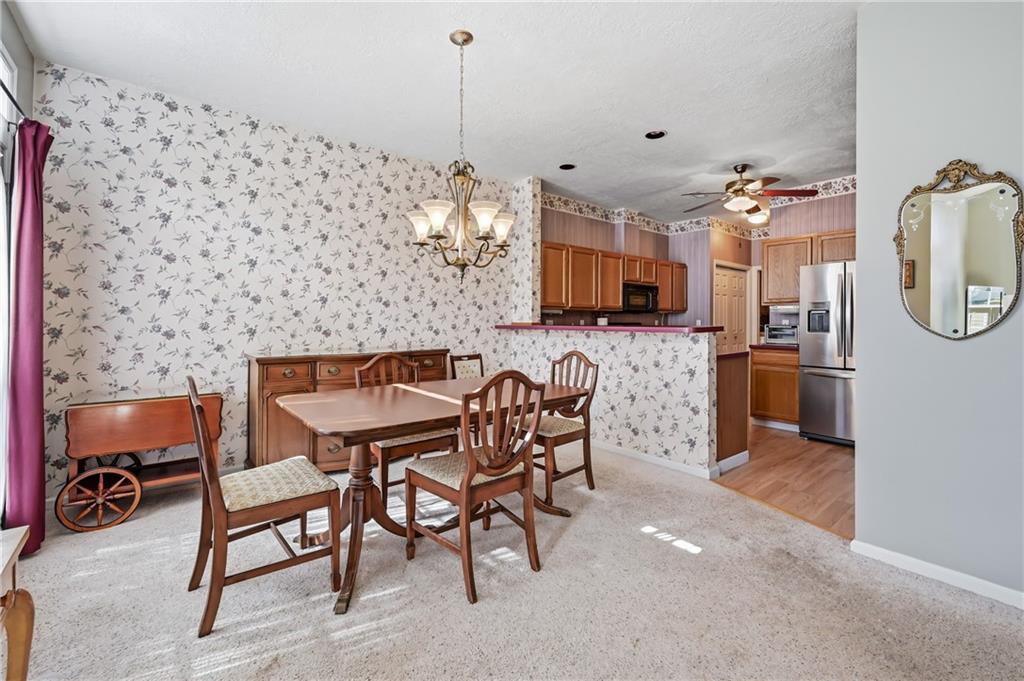 76 Stone Ridge Boulevard Hermitage, PA 16148 - Photo 14 of 34 a view of a dining room with furniture
