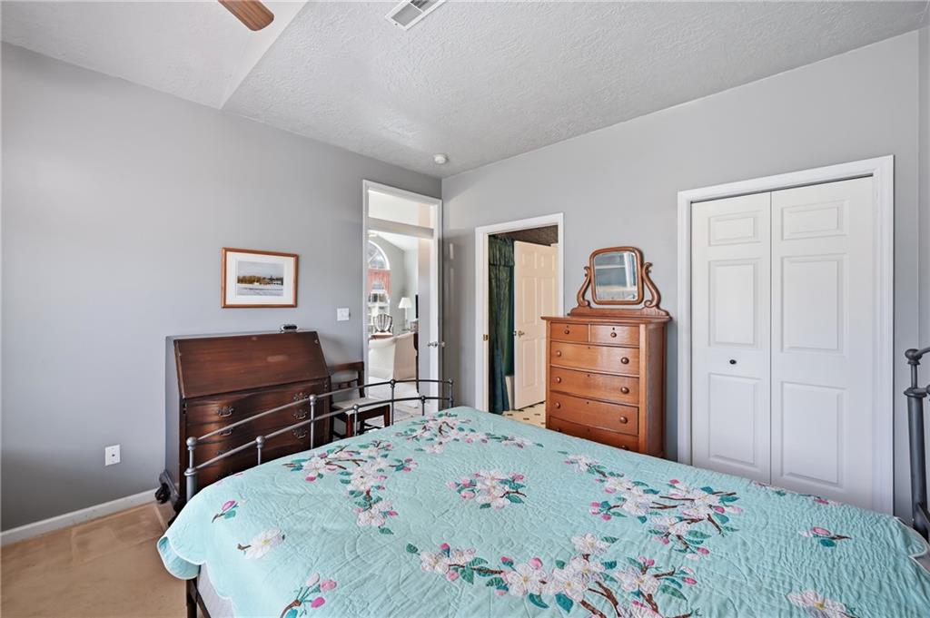 76 Stone Ridge Boulevard Hermitage, PA 16148 - Photo 22 of 34 a bedroom with a bed and furniture