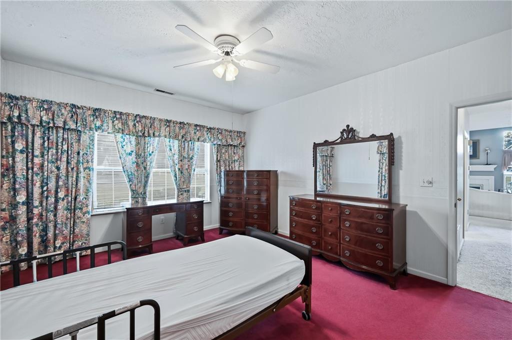 76 Stone Ridge Boulevard Hermitage, PA 16148 - Photo 25 of 34 a bed room with a bed and a dresser