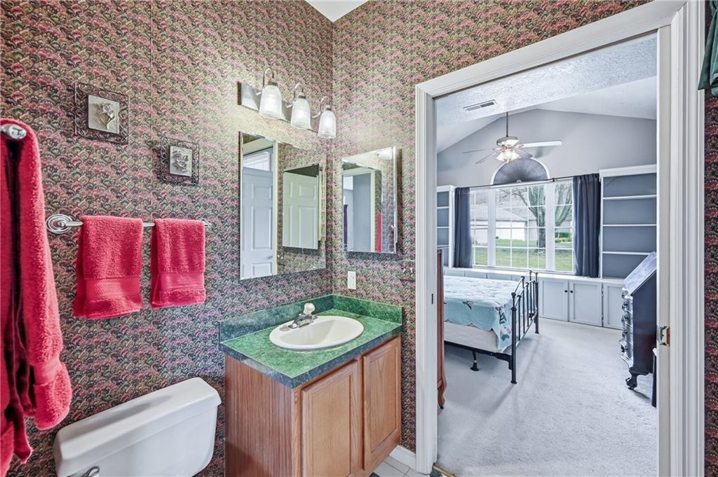 76 Stone Ridge Boulevard Hermitage, PA 16148 - Photo 27 of 33 a bathroom with a sink vanity granite tub shower and couch