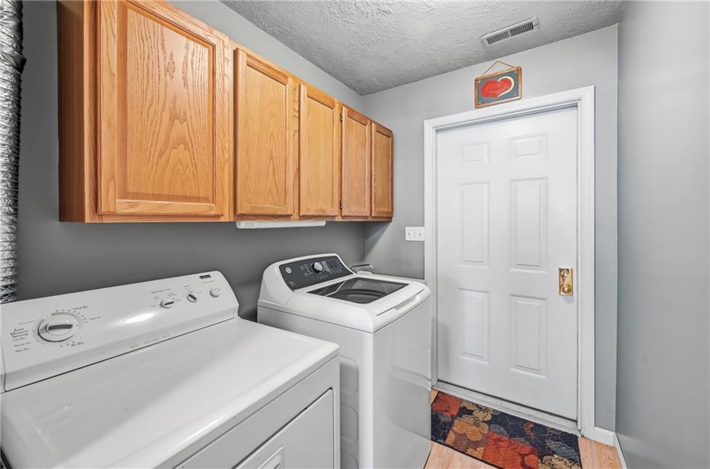 76 Stone Ridge Boulevard Hermitage, PA 16148 - Photo 30 of 34 a view of storage and utility room with washer and dryer