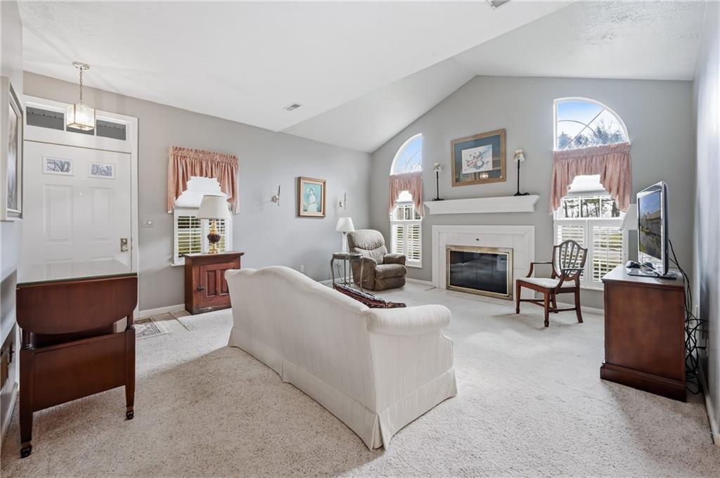 76 Stone Ridge Boulevard Hermitage, PA 16148 - Photo 9 of 34 a living room with furniture a fireplace and a window