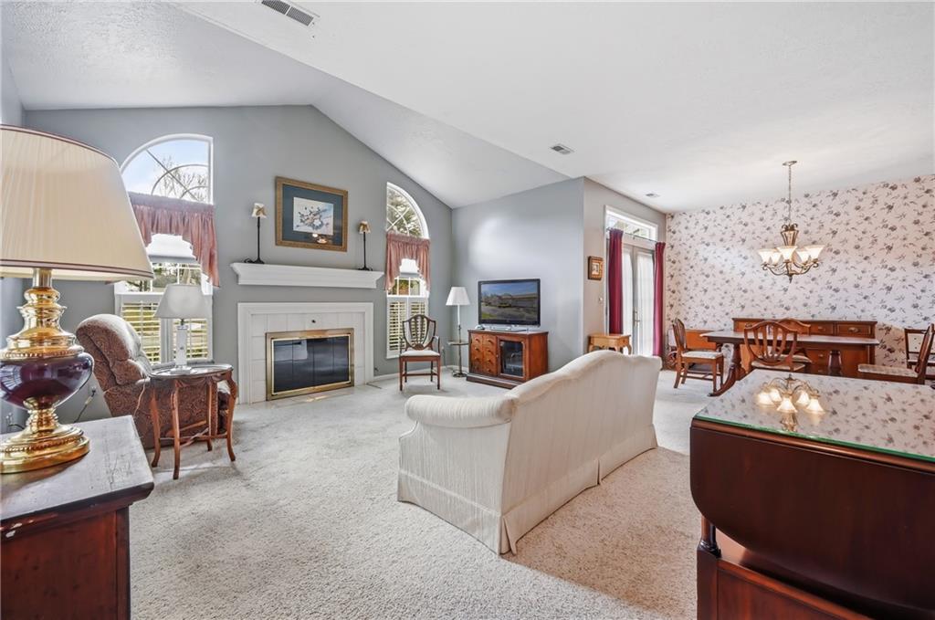 76 Stone Ridge Boulevard Hermitage, PA 16148 - Photo 10 of 34 a living room with furniture a fireplace and a flat screen tv
