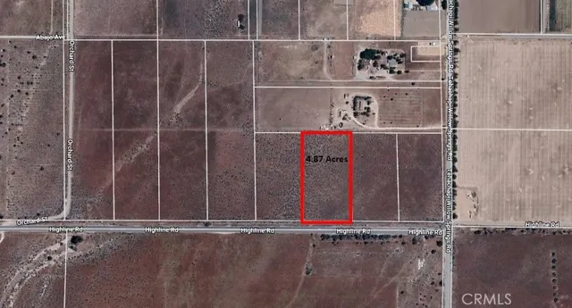 a view of a town with mountains in the background