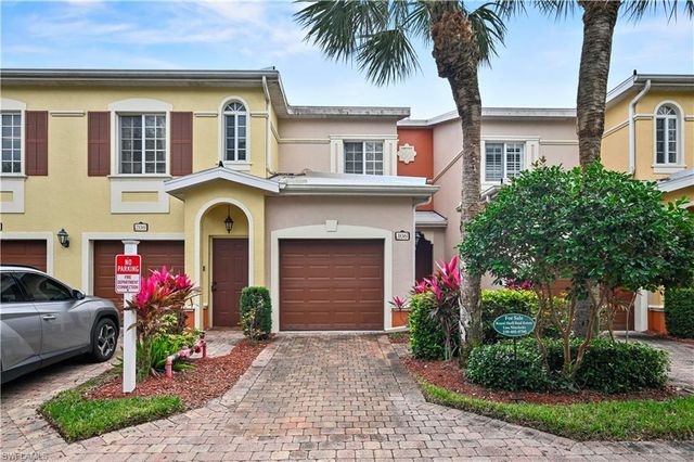 a front view of house and yard with green space