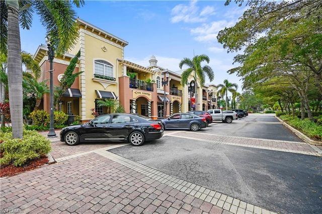a view of street with parked cars