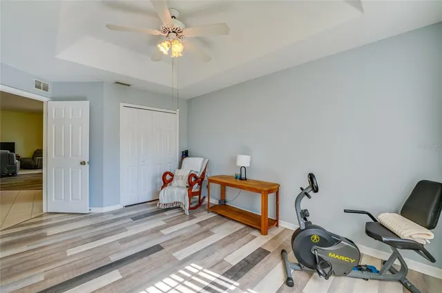 a bedroom with furniture and a chandelier