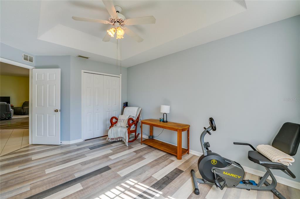 27 Foxhunter Flat Ormond Beach, FL 32174 - Photo 26 of 47 a bedroom with furniture and a chandelier