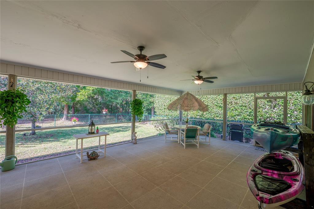 27 Foxhunter Flat Ormond Beach, FL 32174 - Photo 28 of 47 a living room with couch and a floor to ceiling window
