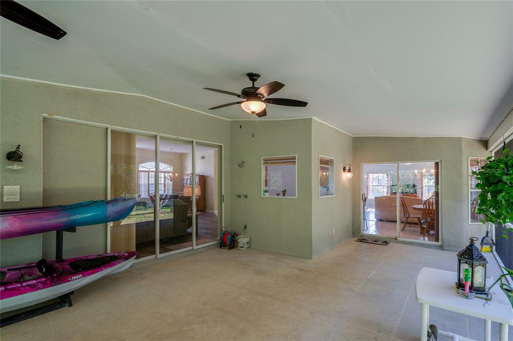 27 Foxhunter Flat Ormond Beach, FL 32174 - Photo 30 of 47 a living room with furniture and a ceiling fan