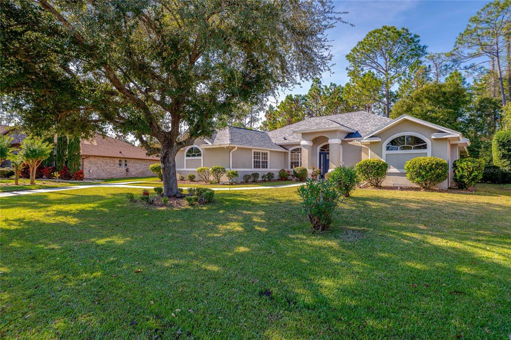 27 Foxhunter Flat Ormond Beach, FL 32174 - Photo 3 of 47 a house view with a garden space