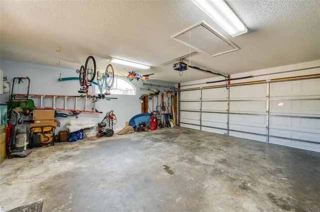 a view of a garage with rack and bicycle