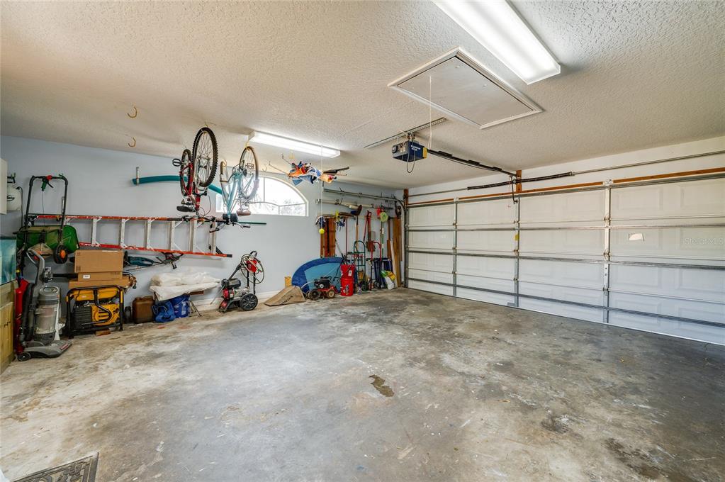 27 Foxhunter Flat Ormond Beach, FL 32174 - Photo 31 of 47 a view of a garage with rack and bicycle