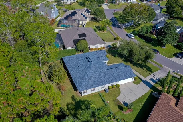 an aerial view of house with a yard