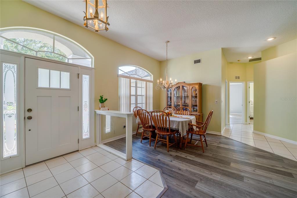 27 Foxhunter Flat Ormond Beach, FL 32174 - Photo 7 of 47 a view of a dining room with furniture window and wooden floor