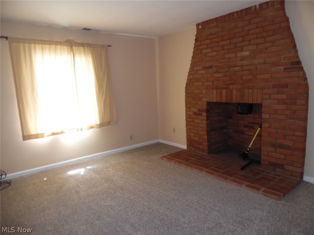 3573 Braun Road Belpre, OH 45714 - Photo 17 of 29 Wood Burning Fireplace in Lower Level Family Room